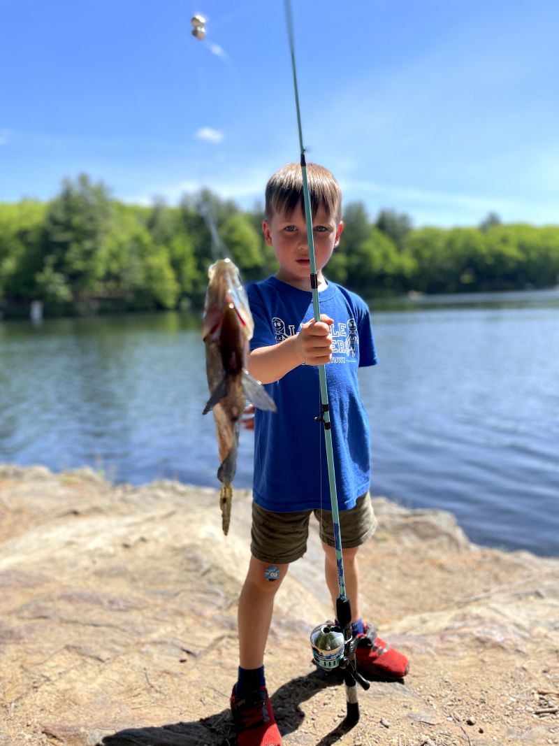 Dave's son catching a fish