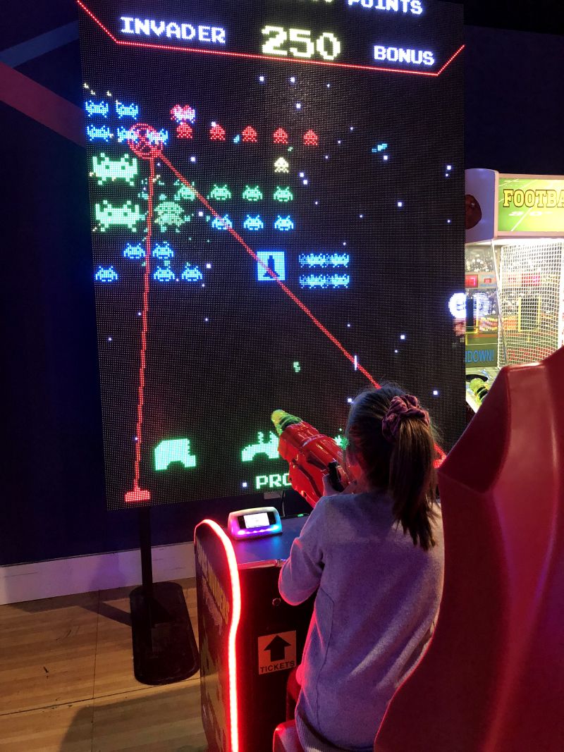 Daughter playing Space Invaders