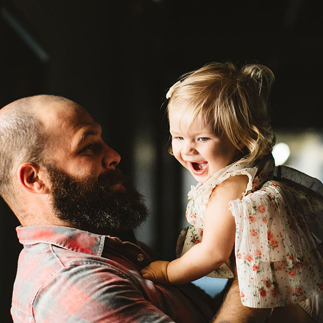 Brand image - dad holding daughter